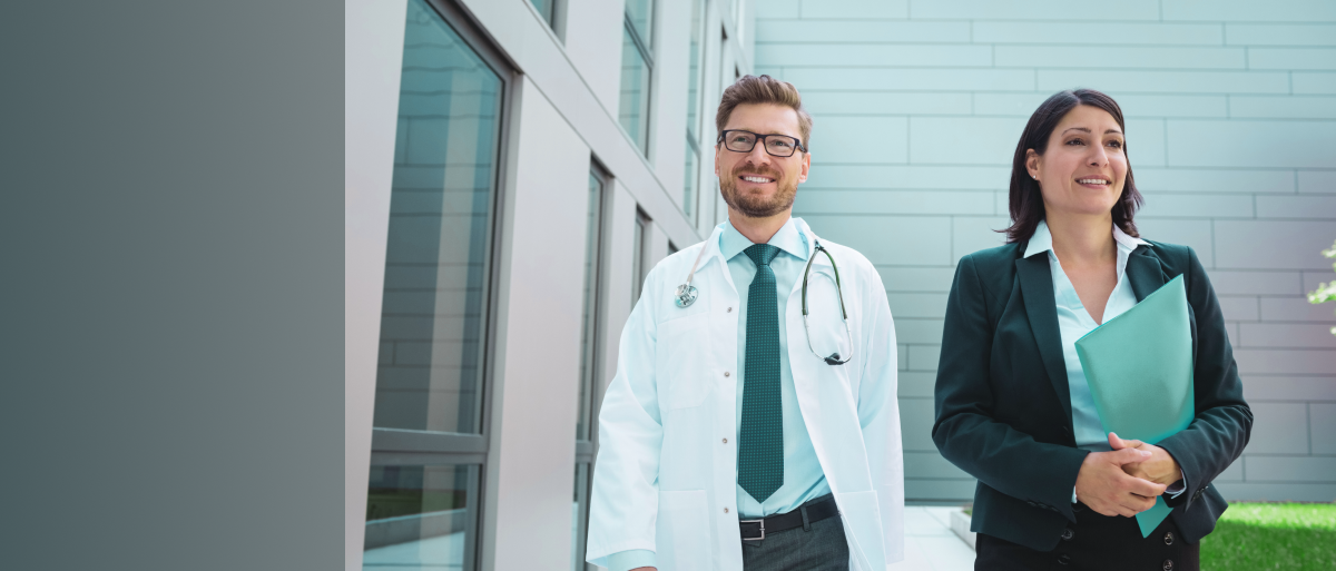 Doctors and businesswoman walking together
